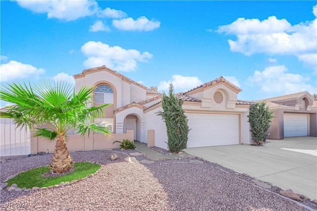 mediterranean / spanish-style home featuring a garage