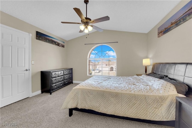 carpeted bedroom with ceiling fan and lofted ceiling