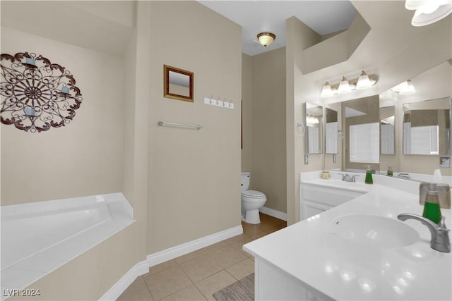 bathroom with tile patterned floors, vanity, a relaxing tiled tub, and toilet