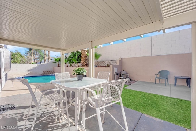 view of patio / terrace with a fenced in pool