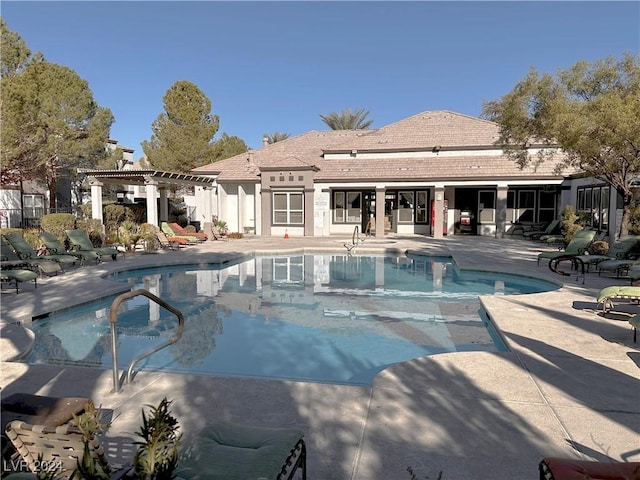 pool featuring a patio area and a pergola