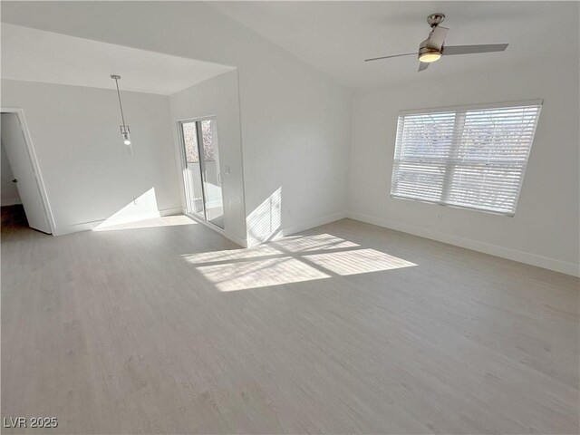 7255 W Sunset Rd Unit 2046, Las Vegas, NV 89113 - empty room featuring light wood-style flooring, ceiling fan, and lofted ceiling