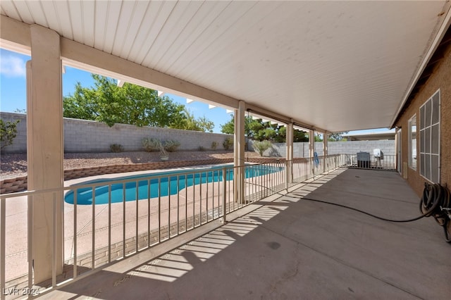 view of pool featuring a patio