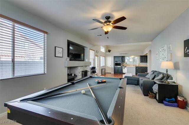 rec room with ceiling fan, a fireplace, carpet, and pool table