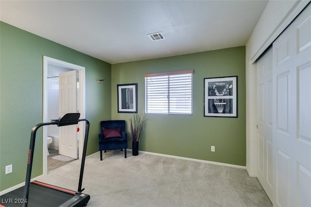 exercise area with light colored carpet