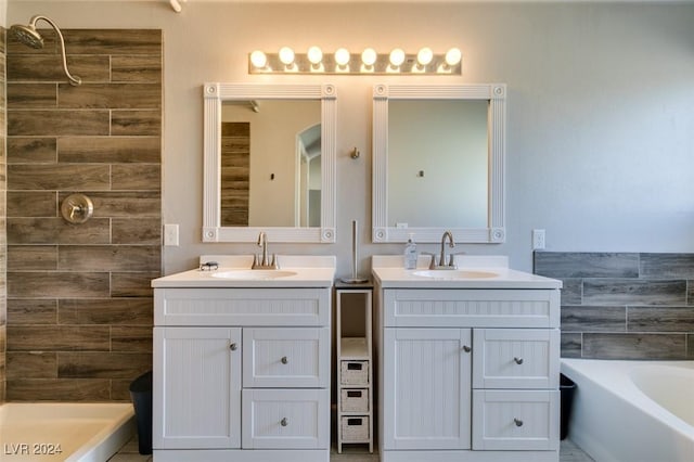 bathroom featuring shower with separate bathtub and vanity