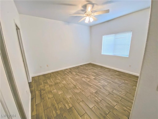 empty room featuring light hardwood / wood-style flooring and ceiling fan