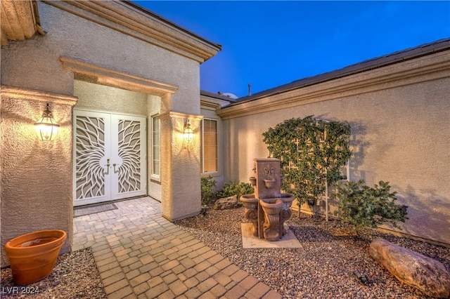 doorway to property featuring french doors