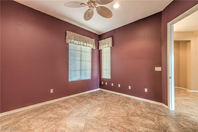 unfurnished room with ceiling fan