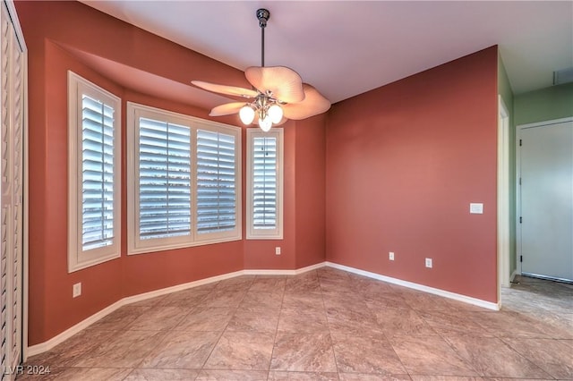 spare room with ceiling fan