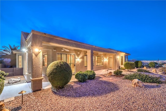 exterior space featuring ceiling fan