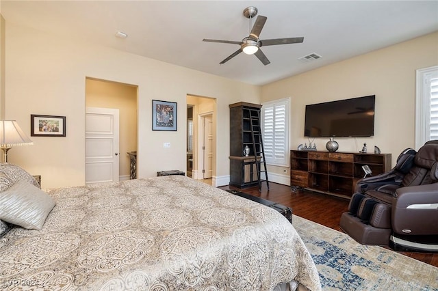 bedroom with dark hardwood / wood-style flooring and ceiling fan