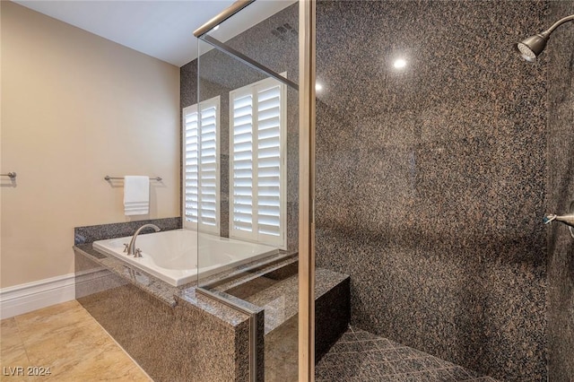 bathroom featuring separate shower and tub