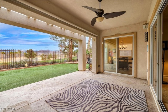 exterior space featuring ceiling fan with notable chandelier