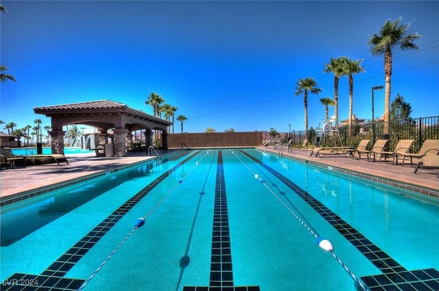 view of swimming pool featuring a gazebo