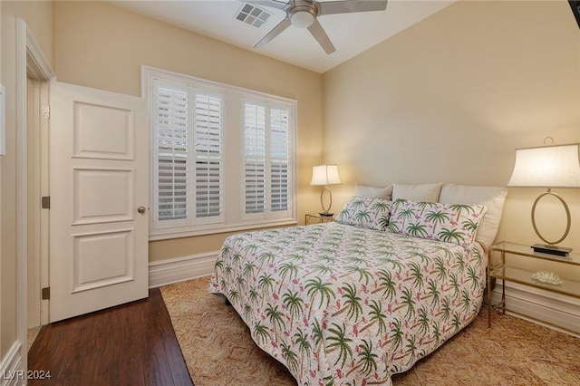 bedroom with ceiling fan and hardwood / wood-style flooring