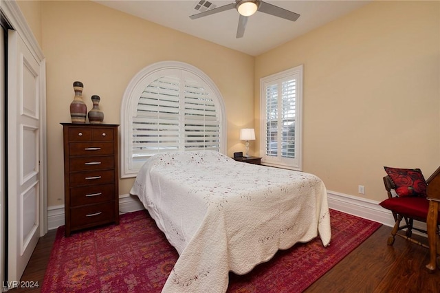 bedroom featuring dark wood-type flooring and ceiling fan