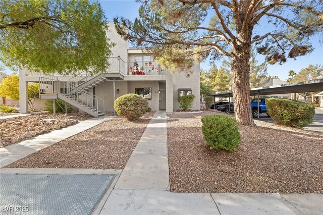 view of front of home featuring a carport