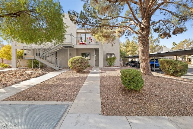 view of front of home featuring a balcony