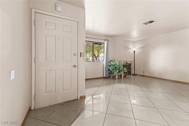 foyer entrance featuring light tile patterned floors