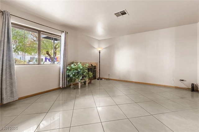 spare room featuring light tile patterned flooring