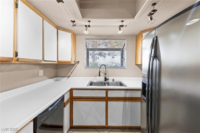 kitchen with rail lighting, sink, stainless steel fridge with ice dispenser, black dishwasher, and white cabinets