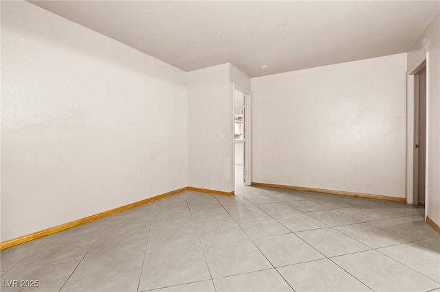 empty room featuring light tile patterned floors