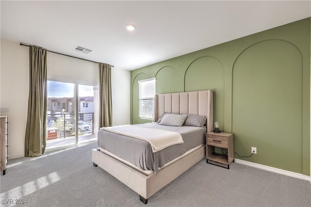 carpeted bedroom featuring access to exterior