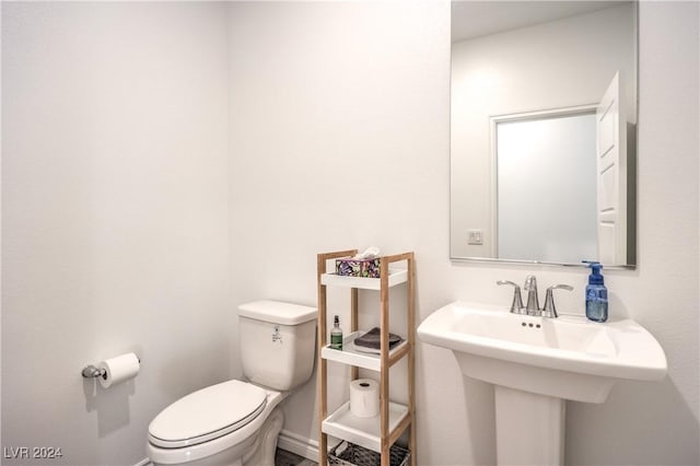 bathroom with toilet and sink