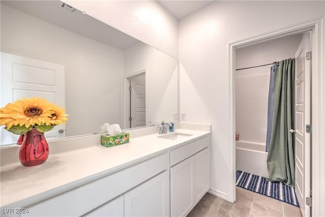 bathroom featuring vanity and shower / bath combo with shower curtain