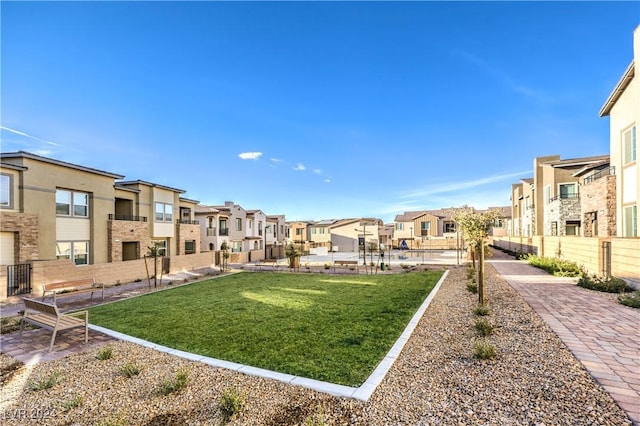 view of home's community featuring a yard