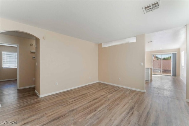 spare room featuring light hardwood / wood-style floors