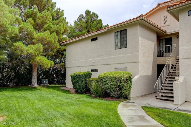 view of home's exterior featuring a lawn