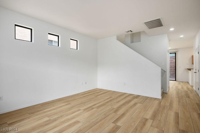 unfurnished room with light hardwood / wood-style floors