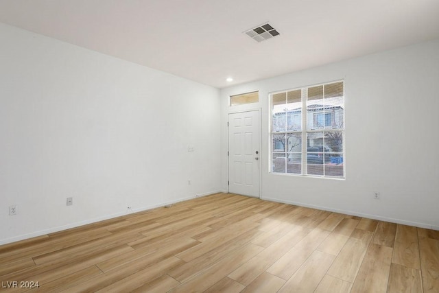 unfurnished room featuring light wood-type flooring