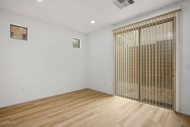 unfurnished room featuring light hardwood / wood-style floors