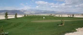 view of property's community featuring view of golf course and a mountain view