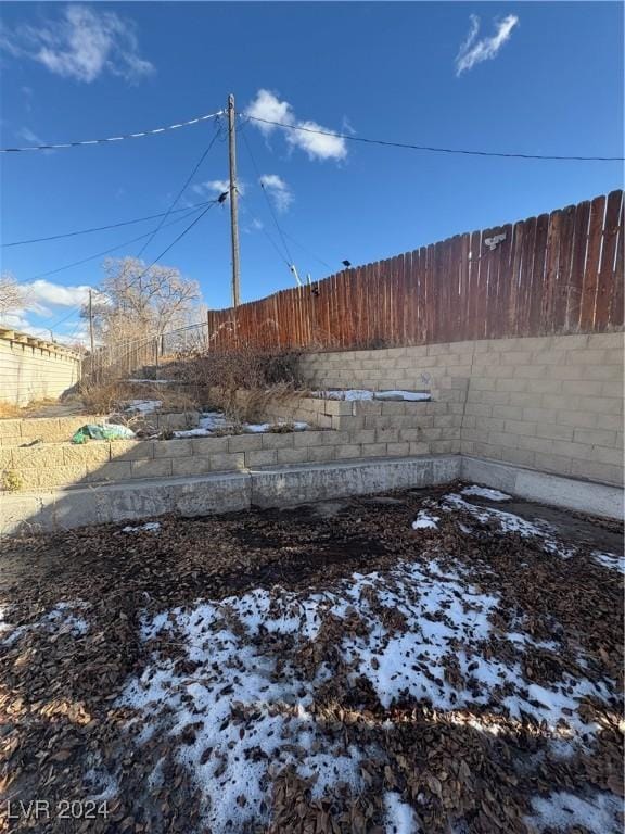 view of yard covered in snow