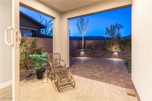 view of patio / terrace with a mountain view