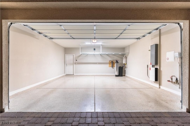 garage with electric panel and a garage door opener