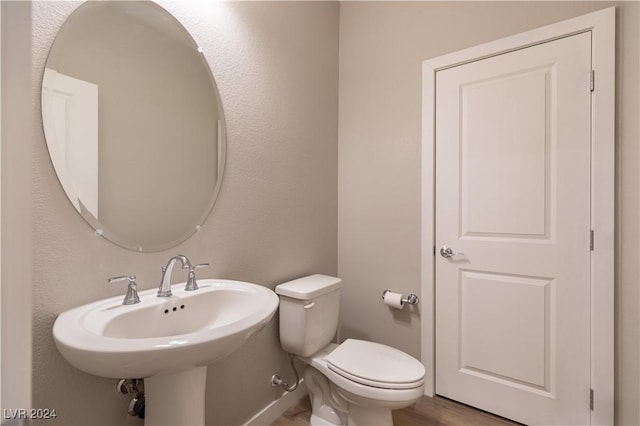 bathroom with toilet and sink