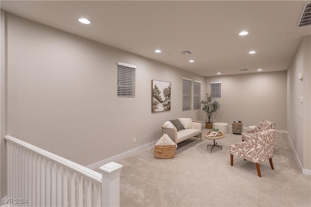 sitting room with light carpet