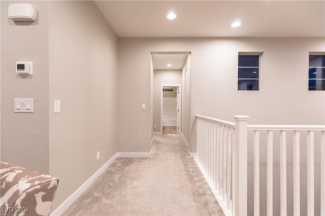 hallway with light carpet