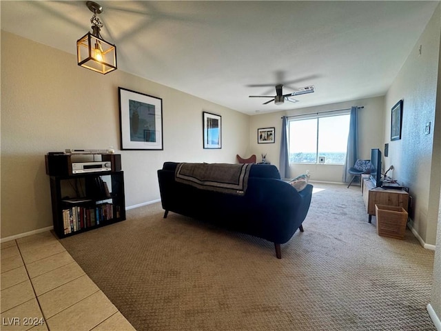 living room featuring ceiling fan and light carpet