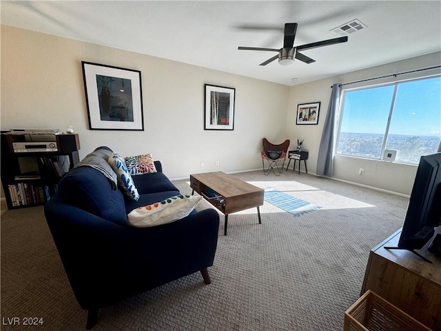 carpeted living room featuring ceiling fan