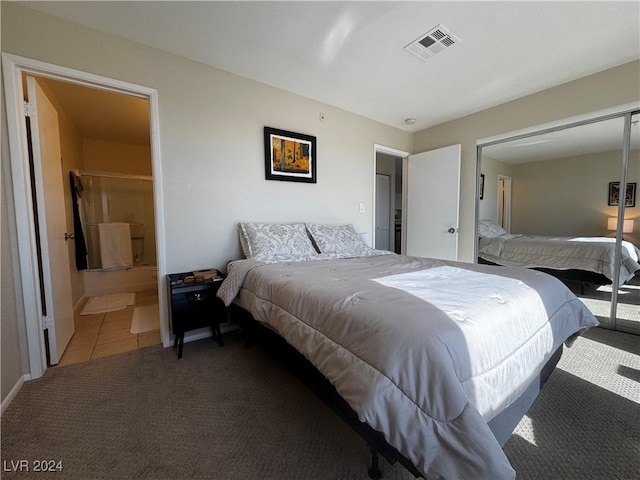 carpeted bedroom with ensuite bathroom