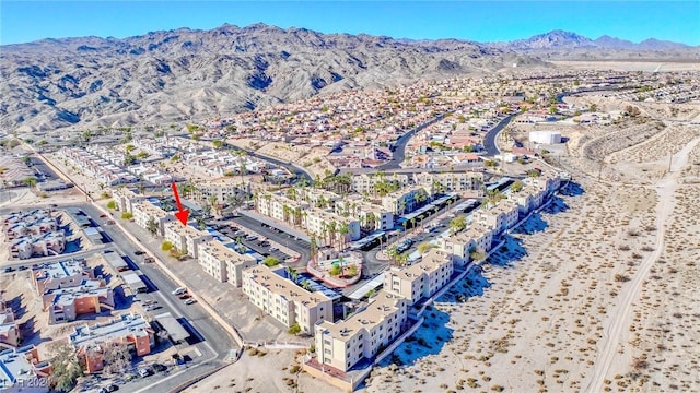 birds eye view of property with a mountain view