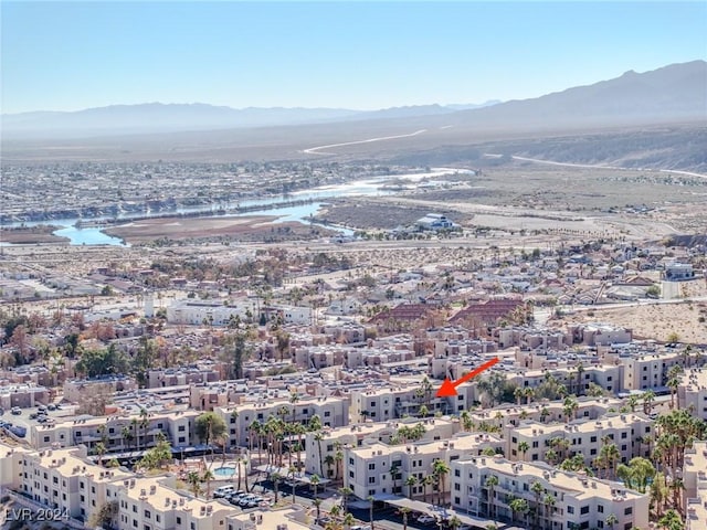 birds eye view of property featuring a water and mountain view