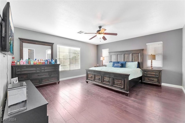 bedroom with ceiling fan and dark hardwood / wood-style flooring