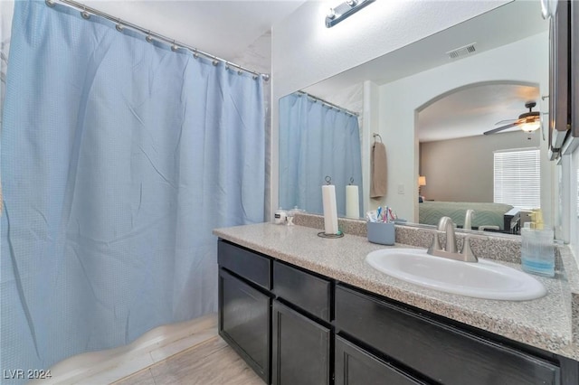 bathroom featuring ceiling fan and vanity